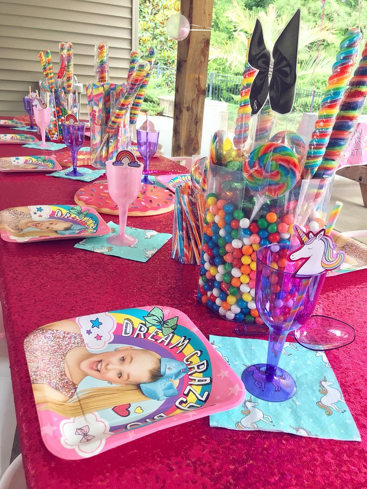 there is a table set up with candy and candies