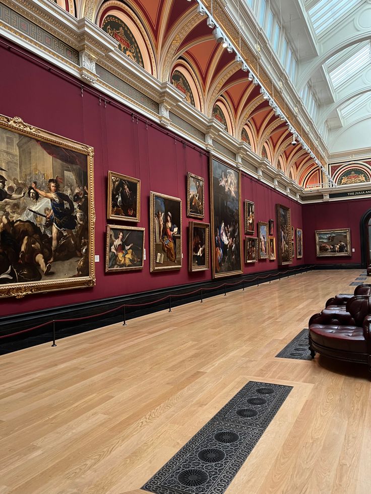 a large room with paintings on the walls