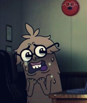 a cartoon character sitting in front of a laptop computer on top of a wooden desk