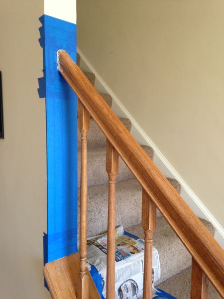 the stairs are being painted blue and white with tape on them to match the carpet