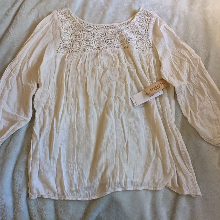 Great Condition, New With Tags, Never Worn. Size Women's Small. Top Shirt Blouse Pattern Lace Lacy White Cream Ivory Off Flowy Light Girl Girls Woman Women Cream Relaxed Fit Top For Brunch, Cotton Blouse With Lace Trim For Brunch, Casual Long Sleeve Cream Peasant Top, Off White Long Sleeve Beach Blouse, Casual Lace Trim Blouse For Spring, Off White Tops For Daywear In Fall, Casual Blouse With Lace Trim And Relaxed Fit, Casual White Blouse With Lace Trim, Relaxed Fit Blouse With Lace Trim For Spring