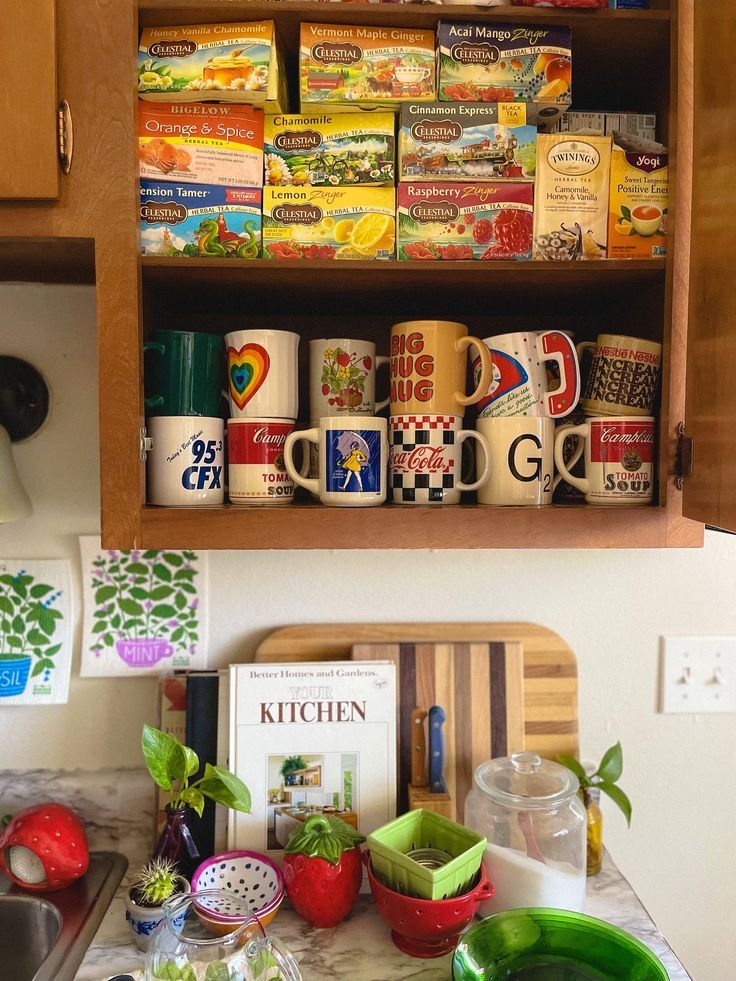 the kitchen counter is full of coffee cups and other items that are stacked on top of each other