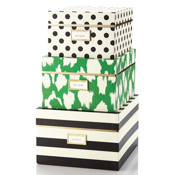 three boxes are stacked on top of each other with black and white polka dot designs