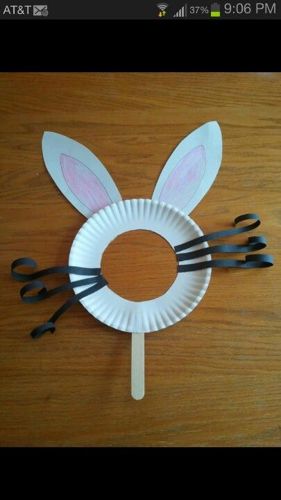 a paper plate with scissors and bunny ears on it