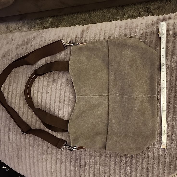 Nwot Gray Canvas Cross Body Bag *Zipper Closure *Canvas Material *Brown Accents *2 Handles *1 Longer Adjustable Shoulder Strap *2 Front Exterior Button Close Pockets *1 Back Exterior Zipper Close Pocket *1 Interior Zipper Close Pocket *3 Interior Open Pockets (One Phone Size, 2 For Pens, Etc.) Pictures Included With Tape For Approximate Measurements Khaki Shoulder Bag With Double Handle And Zipper, Khaki Double Handle Shoulder Bag With Zipper, Everyday Handheld Canvas Bag With Zipper, Handheld Canvas Bag With Zipper For Everyday, Handheld Canvas Bag With Zipper Closure, Khaki Shoulder Bag With Zipper For Everyday Use, Everyday Khaki Satchel With Zipper Closure, Everyday Handheld Canvas Bag With Zipper Pocket, Cross Body Bag