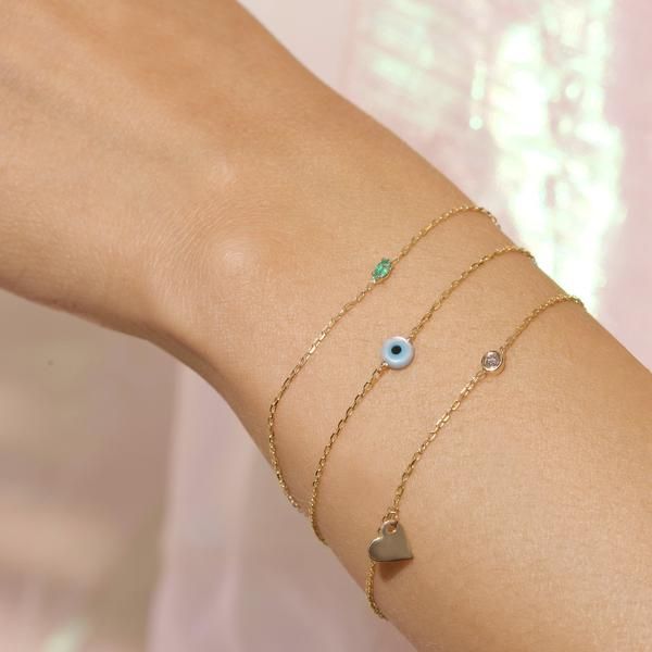 Evil Eye Bracelet – STONE AND STRAND Dainty 14k Gold Jewelry With Natural Stones, Fine Jewelry In 14k Gold With Stones, Fusion Style Jewelry With May Birthstone For Gift, 14k Gold Bracelet With May Birthstone, May Birthstone Fusion Style Gift Jewelry, Fusion Style May Birthstone Jewelry Gift, 14k Gold Fusion Style Jewelry With Gemstone Accents, Fusion Style 14k Gold Jewelry With Gemstone Accents, Sterling Silver Fine Jewelry Bracelets With Jewels