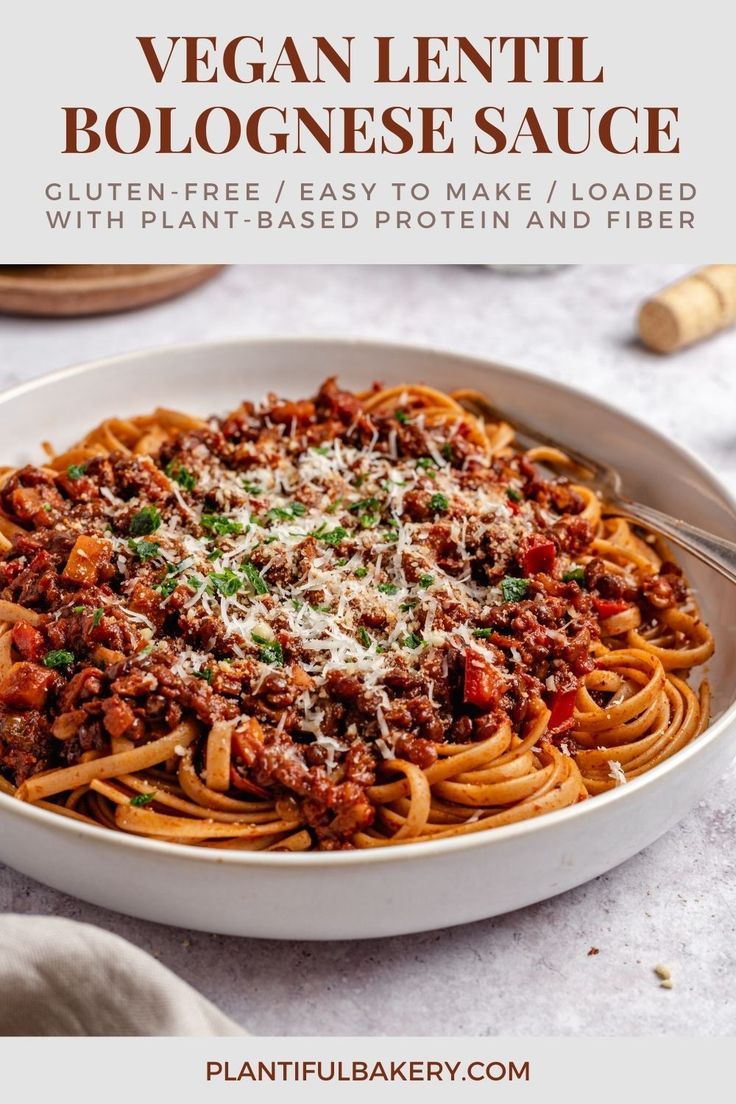 vegan lentil bologine sauce in a white bowl with parmesan cheese on top