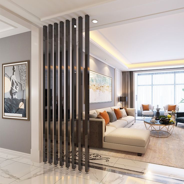 a living room filled with furniture next to a tall painting on the wall above a fireplace