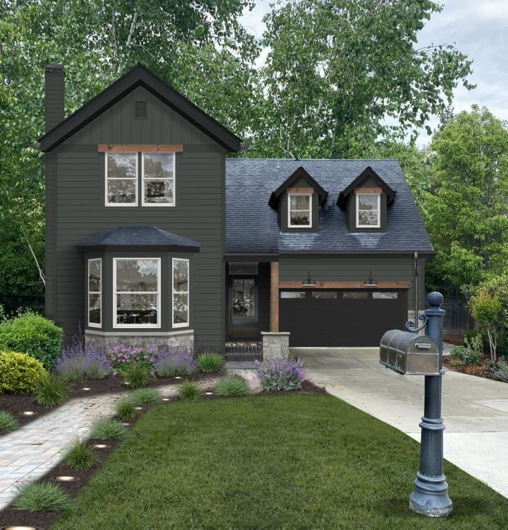 a large gray house with lots of windows