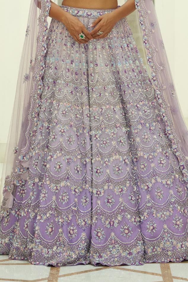 Lilac ombre organza lehenga embroidered in tonal and contrast beads, sequins and crystals in a trellis pattern and attached cancan. Paired with an embroidered padded choli and dupatta.
Components: 3
Pattern: Embroidered
Type Of Work: Sequin, Bead, Crystal
Neckline: Sweetheart
Sleeve Type: Sleeveless
Fabric: Organza, Satin
Color: Purple
Other Details: 
Attached cancan
Padded Blouse
Approx. product weight: 7 - 9 kgs
Lehenga length: 45 inches
Occasion: Wedding, Bride - Aza Fashions Multicolor Embellished Lehenga For Wedding, Embellished Multicolor Lehenga For Wedding, Multicolor Embellished Wedding Gown, Wedding Multicolor Embellished Gown, Fusion Style Lehenga With Traditional Drape For Wedding, Semi-stitched Embroidered Fabric For Reception In Purple, Semi-stitched Embroidered Fabric For Reception, Purple, Purple Embroidered Fabric For Wedding And Eid, Fusion Style Wedding Sharara With Dupatta