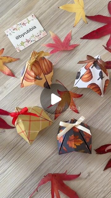 an assortment of autumn paper decorations on a wooden floor