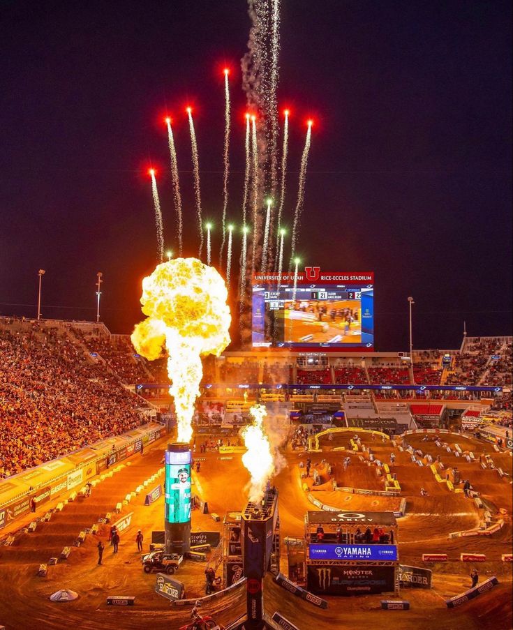 fireworks are lit up in the air at a sporting event