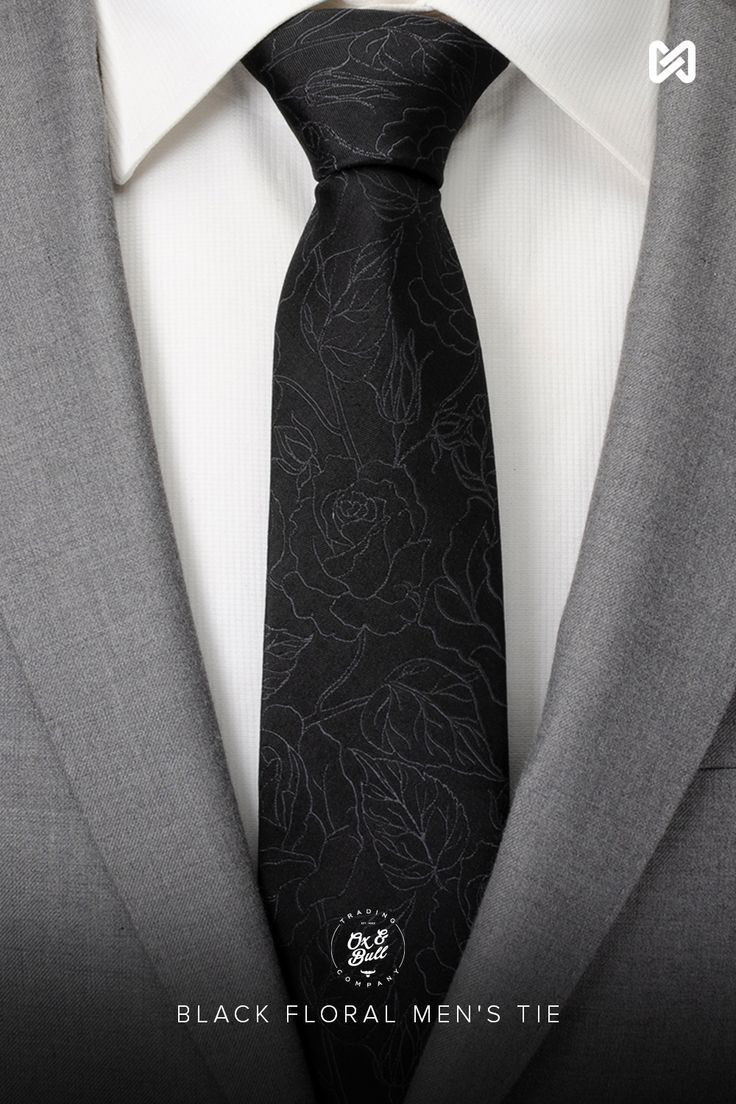 A beautiful yet masculine black floral design creates the subtle pattern on this black men's tie. Our tie will maintain its shape and hold a perfect knot thanks to the durable yet soft 100% Silk. A perfect accessory that can be worn for formal events or special occasions. Pairs well with our Soft Gray Floral Pocket Square. Black Tie For Black Tie Events, Elegant Black Ties For Black-tie Events, Elegant Black Standard Tie And Suit Accessories, Elegant Black Suit And Tie Accessories For Black-tie Events, Elegant Black Suit And Tie Accessories, Black Standard Tie For Wedding Suits, Black Ties For Black-tie Events, Elegant Black Ties For Semi-formal Occasions, Semi-formal Black Suit And Tie Accessories