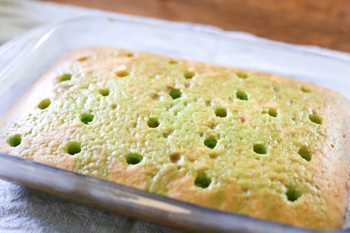 a casserole in a glass baking dish on a table with a cloth underneath it