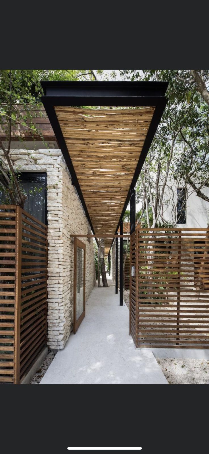 the walkway is lined with wooden slats