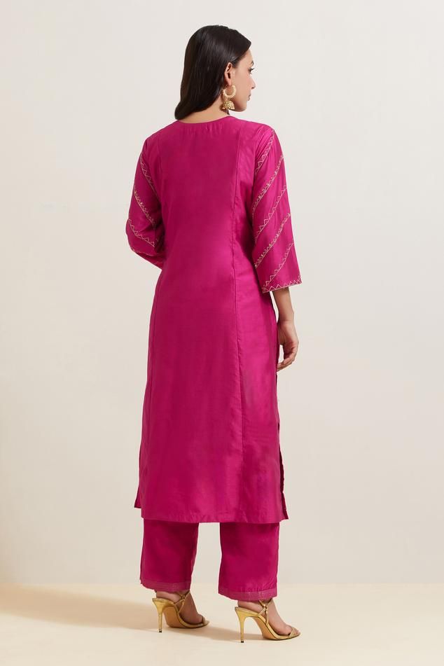 Pink natural weaves chanderi silk kurta with contrast paisley and floral embroidery. Comes with pant and shimmer organza dupatta.
Components: 3
Pattern: Embroidered
Type Of Work: Floral and Paisley
Neckline: Notched
Sleeve Type: Three Quarter
Fabric: Chanderi Silk, Shimmer Organza
Color: Pink
Other Details: 
Embroidered hem pant
Fringed border dupatta
Occasion: Puja - Aza Fashions Straight Kurta With Resham Embroidery In Slub Silk, Traditional Wear Resham Embroidery Straight Kurta, Silk Kurta With Resham Embroidery For Diwali, Silk Kurta With Chikankari Embroidery For Navratri, Unstitched Kurta With Chikankari Embroidery In Slub Silk, Diwali Tussar Silk Palazzo Set With Zari Work, Navratri Silk Kurta For Designer Wear, Navratri Designer Silk Kurta, Silk Palazzo Set With Zari Work And Straight Kurta