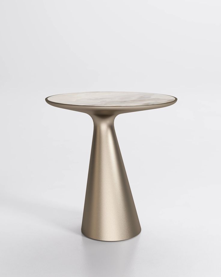 a round table with a white marble top and gold metal base, on a white background