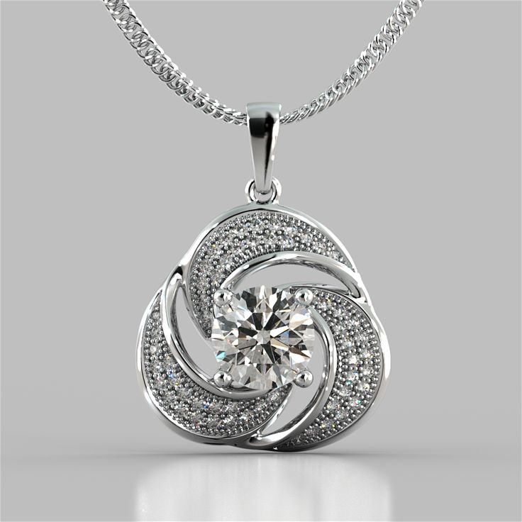 Express your love for all the finer things with this sparkling pendant. Featuring an astonishingwave likedesign all completed with our beaming simulated diamonds that are sure to please any lady.Pendant features a bail slide that always sits flush on yourdcollet.A divine way to dress up any occasion. Round Cut Swirl Halo Pendant;  Center Stone: 1.25 CT;  Total Carat Weight: 1.54 CTW;  Stone Clarity: VVS-1;  Available in: 14K White Gold;  16" 14K White Gold Chain Included;  Model:PD2493-WH; Galaxy Diamond, Round Diamond Pendant, Jewelry Manufacturer, Halo Pendant, Solitaire Pendant, Fine Jewellery Necklace, Flower Pendant, Pendant Set, Round Cut Diamond