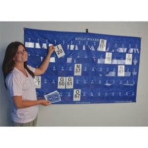 a woman standing in front of a blue banner with numbers and symbols on it,