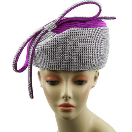 Introducing the Church Hat 8909, a beautifully crafted accessory that exudes sophistication and class. Designed for those who appreciate elegance and style, this hat is the perfect finishing touch to any formal ensemble. With its classic silver base and vibrant purple embellishments, this headpiece not only captures attention but also complements a wide range of outfits, making it versatile for any event. The Church Hat 8909 is not only aesthetically pleasing but also constructed with comfort in Elegant Cloche Headpiece For Formal Occasions, Fitted Silver Mini Hat For Formal Occasions, Elegant High Crown Hats For Formal Occasions, Adjustable Silver Costume Hats For Evening, Elegant Formal Costume Hat With Structured Crown, Elegant Silver Mini Hat For Formal Events, Elegant Silver Mini Hat For Formal Occasions, Silver Wide Brim Costume Hat For Party, Elegant Mini Hats With Structured Crown For Formal Occasions