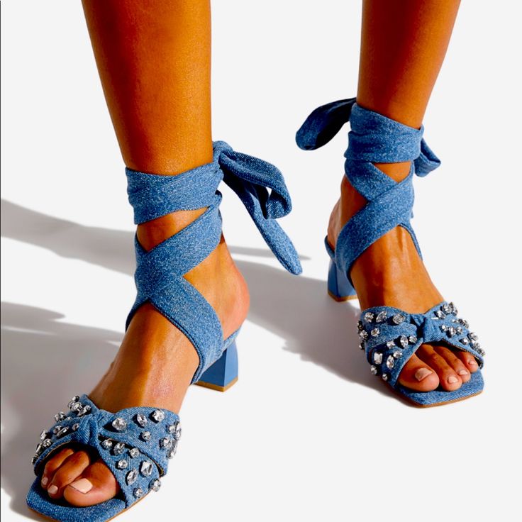 A Sandal Featuring A Low Block Heel, Square Toe, And Wraparound Ankle Ties. Material: Textile Features: Extra Padding For Added Comfort Outside Heel Height: 1.75" Closure: Ankle Ties Casual Open Toe Lace-up Sandals For Party, Trendy Flat Heel Lace-up Sandals For Party, Adjustable Blue Heels For Summer, Casual Lace-up Sandals With Flat Heel For Party, Casual Party Lace-up Sandals With Flat Heel, Blue Adjustable High Heel Sandals, Adjustable Blue High Heel Sandals, Flat Synthetic Lace-up Sandals For Party, Casual Flat Lace-up Sandals For Party