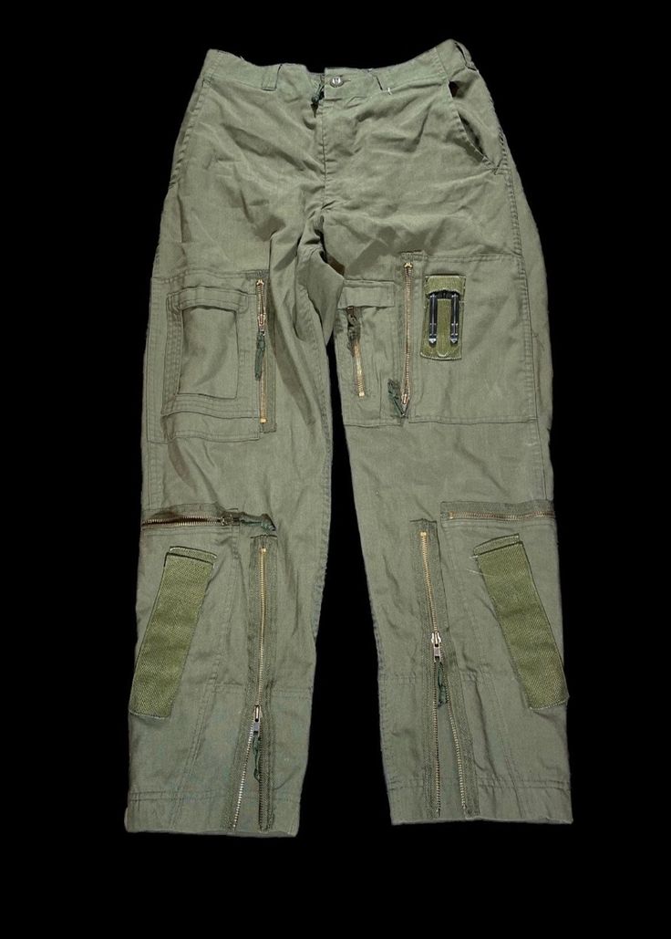 These are Vintage 1980s Military issued Cargo pants, Tons of pockets and details these are super unique and will complement any outfit! Faded Sun Burned Olive and Non Faded Available!..  Product Photos are the non faded pair.. Photos on Model are the Sun burned faded olive Pair! Please Let us know your preference before ordering! 🤟🏼 1980s Tactical Military Trousers Size / All sizes Available  Color: Vintage Olive  Please note all items are examined to the best of our ability. Most items are 20+ years old and are not in perfect condition small imperfections are to be expected any major flaws will be disclosed.  No major flaws Condition:9/10 MESSAGE WITH OFFERS AND QUESTIONS  NO RETURNS  FOLLOW OUR PAGE FOR DAILY HEAT NEW ITEMS DROP DAILY! Vintage Cargo Jeans For Streetwear, Vintage Streetwear Cargo Pants With Pockets, Vintage Cargo Pants With Pockets For Streetwear, Vintage Cargo Jeans With Patch Pockets For Streetwear, Vintage Streetwear Pants With Multiple Pockets, Vintage Cargo Style Pants For Streetwear, Vintage Streetwear Pants With Pockets, Vintage Pants With Pockets For Streetwear, Retro Streetwear Pants With Belt Loops