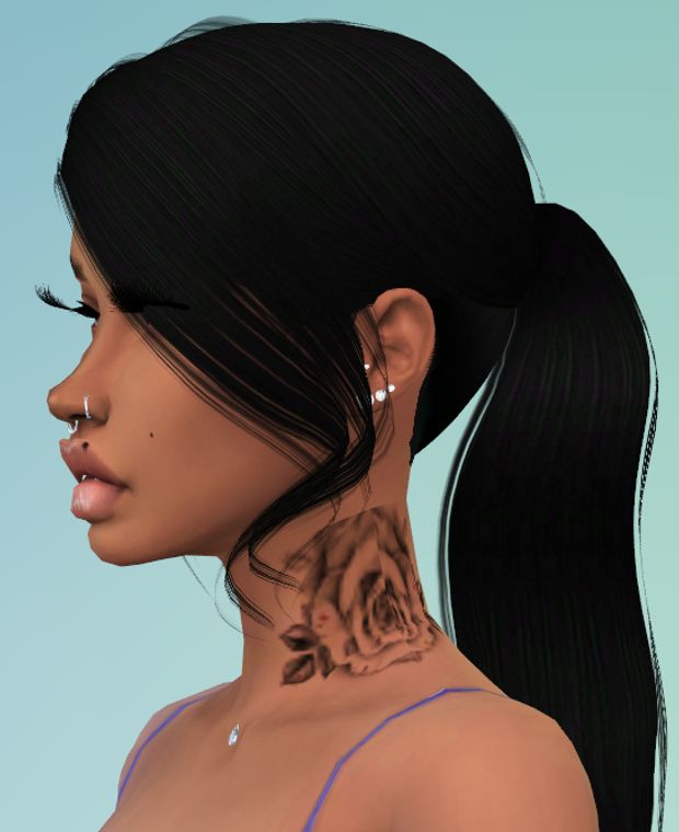 a woman with tattoos on her neck and shoulder