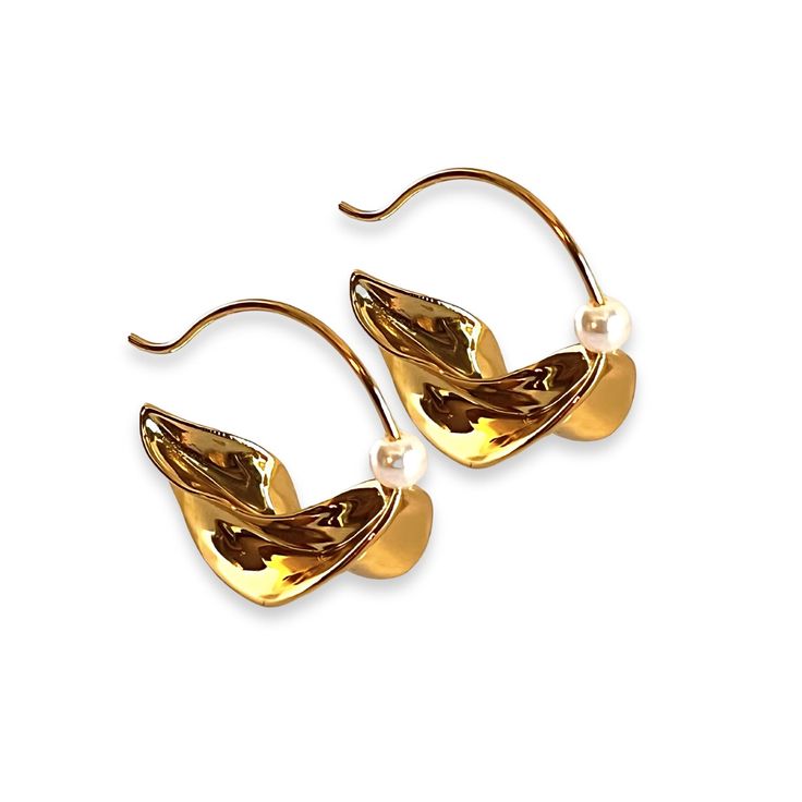 Inspired by the traditional Fulani earrings worn by Fulani women in West Africa, these semi-hoop earrings offer a modern twist on a timeless design. Featuring an irregular shape, they create a unique yet elegant look that stands out. The addition of a water pearl adds a refined touch of sophistication, while the gold plating gives the earrings a rich, luxurious finish. Perfect for both everyday wear and special occasions, these earrings blend cultural heritage with contemporary style, making the Modern Single Earring For Everyday, Modern Gold Plated Wrap Earrings, Elegant Hoop Wrap Earrings For Pierced Ears, Elegant Tarnish-resistant Hoop Wrap Earrings, Modern Twist Tarnish Resistant Hoop Earrings, Modern Twist Hoop Earrings In Metal, Metal Pearl Earrings With Plating, Yellow Gold Metal Pearl Earrings, Gold Plated Hoop Earrings With Elegant Design