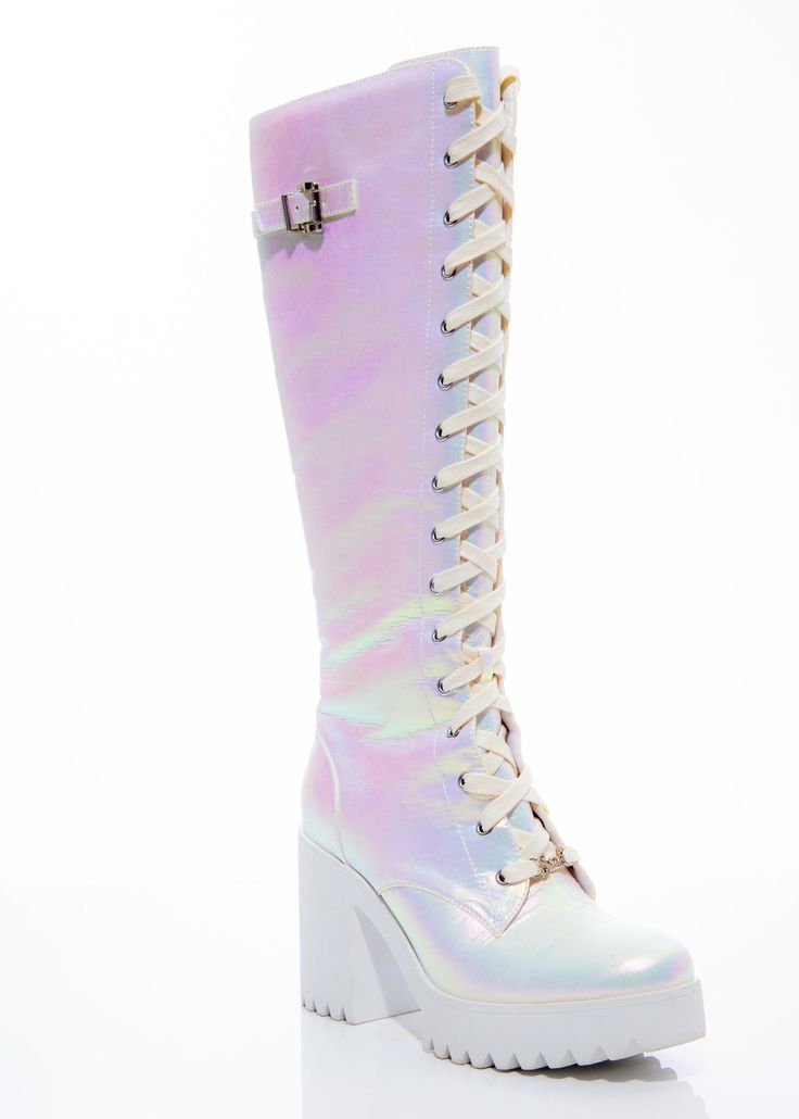 Paris Boot Captivating at first glance, our Paris Boot is a manifestation of verve and flair. From white iridescent elegance to lace-up glamour, embrace a footwear experience that mirrors your individuality. These boots aren't just accessories; they're a style proclamation that demands admiration. Key Features: Iridescent Elegance: Transform each step into a mesmerizing dance of colors that reflect distinct charm with the white iridescent finish. Lace-Up Glam: Elevate your fashion narrative with Knee High Boots Chunky, Fairy Couture, Lace Up Knee High Boots, White Fairy, Lace Accessories, Boots Chunky, Sequin Outfit, Boots White, Cute Boots