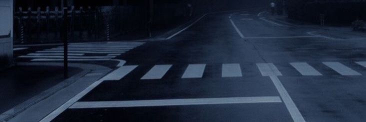 an empty street at night in the dark