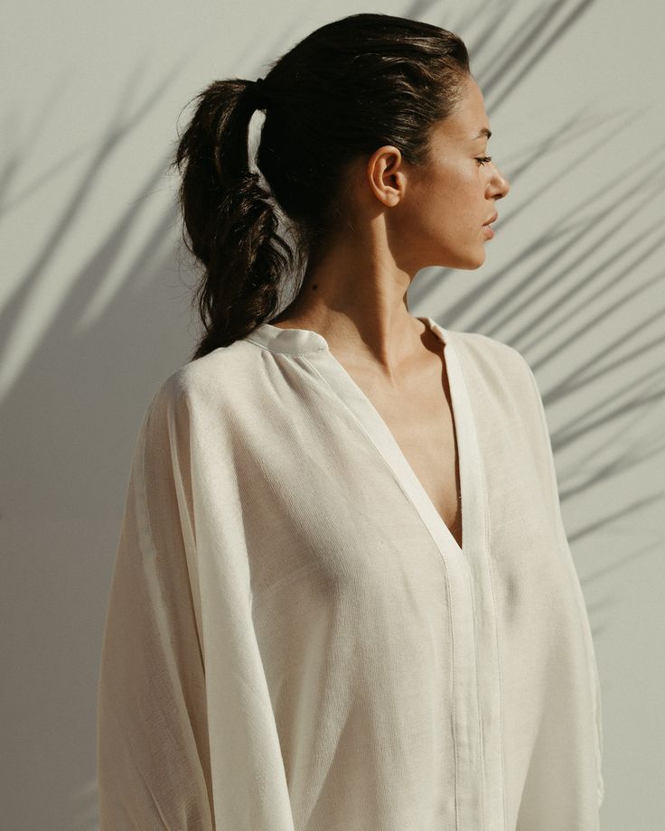 Gaia linen kaftan dress in jasmine white - Soukra Daywear Relaxed Fit Tunic With Split Neck, Relaxed Fit Split Neck Tunic For Daywear, Elegant White Kaftan For Daywear, Chic White Maxi Dress For Loungewear, Elegant Spring Kaftan For Loungewear, Elegant Spring Kaftan For Beach Cover-up, White Relaxed Fit Maxi Dress For Loungewear, Chic Oversized White Maxi Dress, White Flowy Maxi Dress For Loungewear