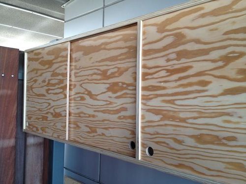 the cabinets are made from plywood and have been painted with acrylic paint