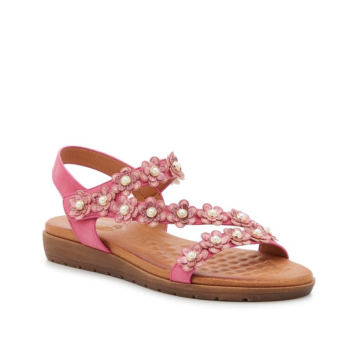 Patrizia-Pearlja Sandal Your outfit will be in full bloom when you add the Pearlja sandal to your collection. This pair features a strappy silhouette, a slight wedge heel, and floral embellishments that take your look to the next level. Complete with a padded footbed to keep you comfortable throughout the day. Feminine Embellished Open Toe Sandals, Spring Embellished Open Toe Wedge Sandals, Pink Embellished Sandals For Summer, Spring Embellished Pink Sandals, Pink Embellished Synthetic Sandals, Pink Feminine Sandals With 4-inch Heel, Pink Square-toe Beach Sandals, Pink Cork-bed Beach Sandals, Pink Flower-shaped Sandals For Summer