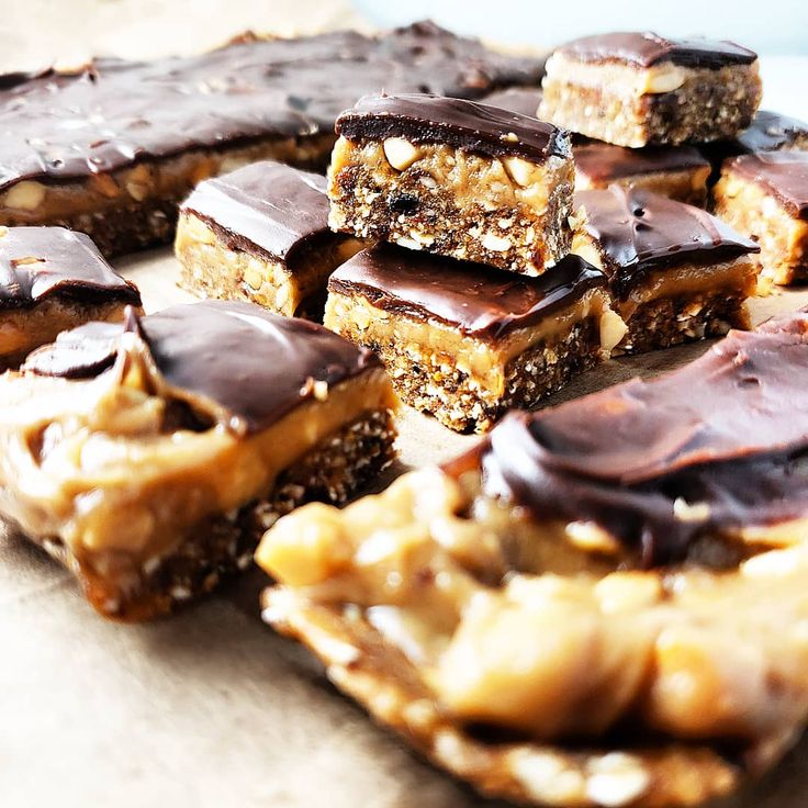 chocolate and peanut butter bars are stacked on top of each other, ready to be eaten