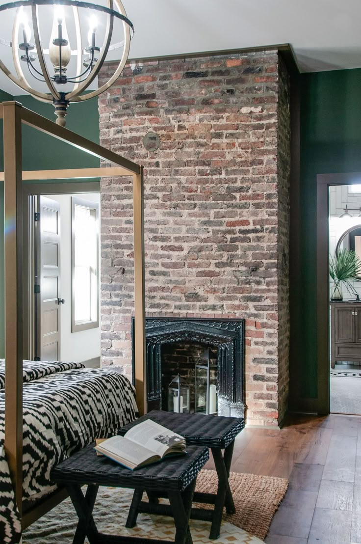 a living room with a couch, table and fireplace