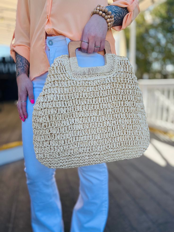 Meet our St. Tropez Straw Bag! This style is perfect for either a day at the beach or just as an accessory for your Vacay or Summer outfit. It includes a zipper closure, an interior pocket, and also a tan interior. This bag is lightweight with sturdy and durable handles, and is able to hold a lot of your necessities! *Snap the sides to create another look! Measurements: 17" L x 15" H Materials: 100% Paper Casual Beige Pouch Beach Bag, Lightweight Beige Rectangular Beach Bag, Summer Beige Shoulder Satchel, Summer Style Beige Satchel Shoulder Bag, Summer Beige Shoulder Bag Satchel, Casual Rectangular Satchel For Vacation, Summer Beige Satchel Shoulder Bag, Summer Beige Hobo Bag Pouch, Beige Summer Hobo Pouch Bag