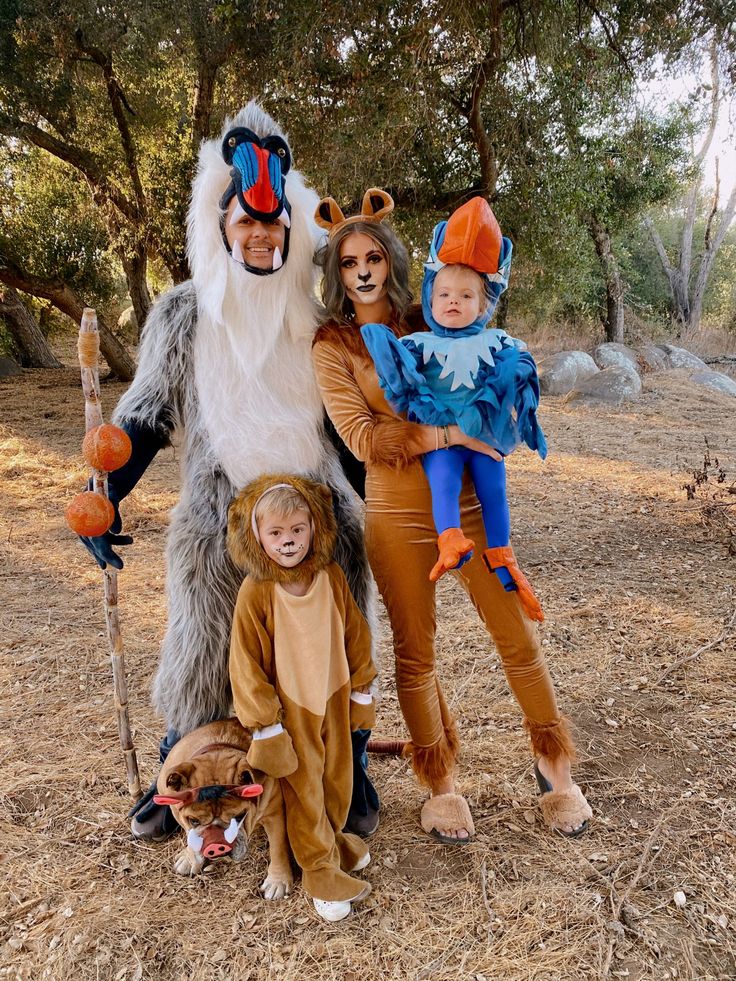 three children and an adult dressed up in costumes