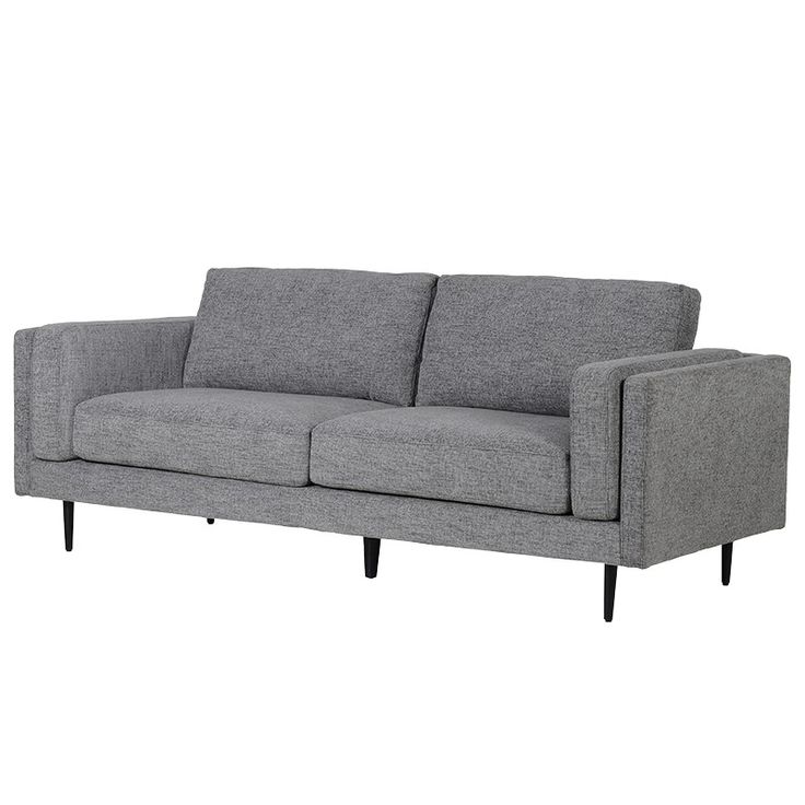 a gray couch sitting on top of a white floor