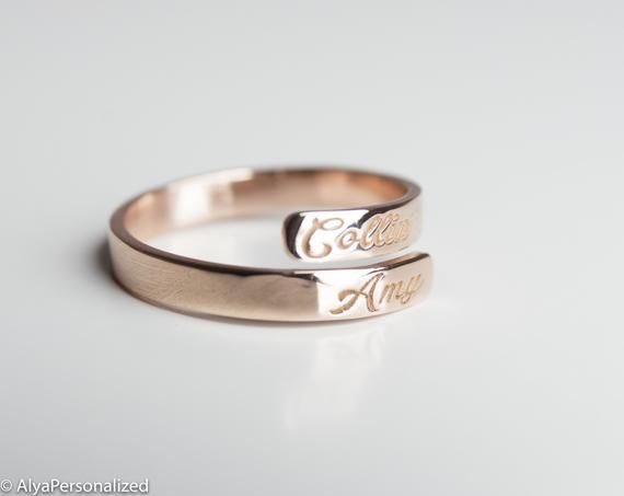 Engraved personalized name ring; wedding bands for women... Also perfect promise ring for your special woman ♡ ► FEATURES;Material Options: 14k Rose Gold, 14k Yellow Gold, 14k White GoldSize: All ring sizes are available► HOW TO ORDER;Please select your preffered size and material from the menu while adding to card.► PROCESSING & SHIPPING❥Your order will be handmade in 3-6 business days.❥Shipping time is 2-5 days to US.❥Please check the shipping times to other countries by writing your count Personalized Engraved Rose Gold Ring, Customizable Rose Gold Promise Rings, Customizable Rose Gold Promise Jewelry, Personalized Rose Gold Stackable Rings For Promise, Adjustable Engraved Rose Gold Ring For Anniversary, Adjustable Engraved Rose Gold Promise Ring, Adjustable Engraved Wedding Rings, Elegant Couple Rings With Engraving Option For Wedding, Adjustable Rose Gold Engraved Ring For Anniversary