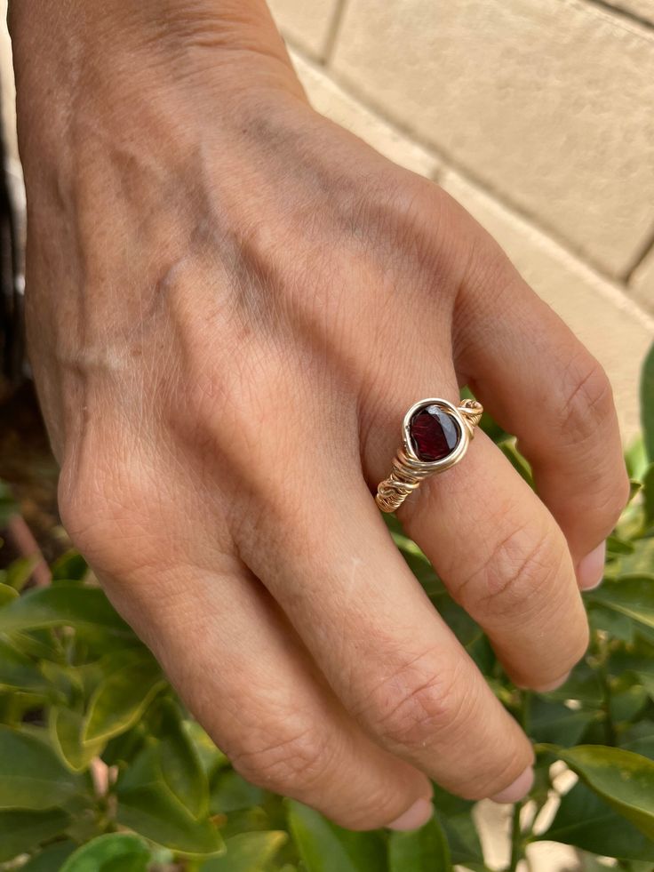 This is the ruby wire wrap ring and 18kt gold 💎✨ Ruby Wire Wrapped Jewelry As Gift, Ruby Wire Wrapped Jewelry Gift, Wire Wrapped Ruby Jewelry Gift, Hand Forged Ruby Ring Jewelry, Hand Forged Ruby Ring In Red, Hand Forged Red Ruby Ring, Elegant 14k Gold Wire Wrapped Rings, 14k Yellow Gold Wire Wrapped Rings, 14k Gold Wire Wrapped Rings