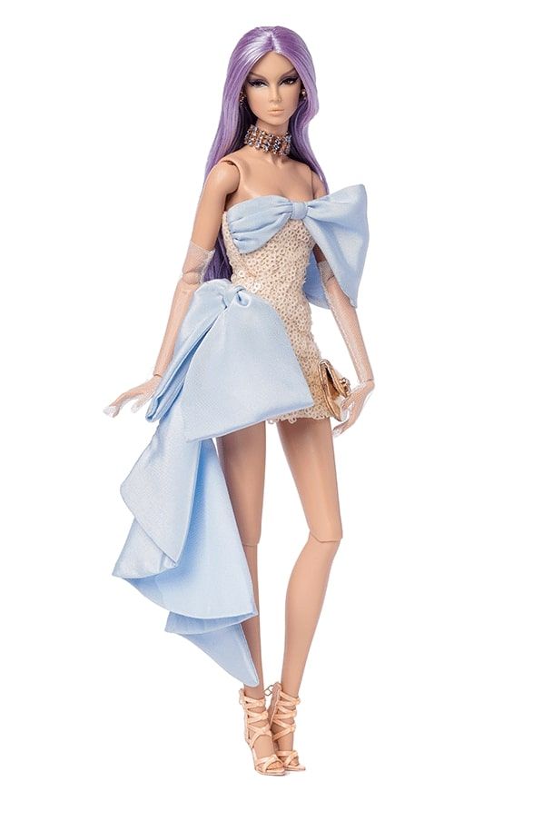 a barbie doll wearing a blue dress and high heels with her hand on her hip