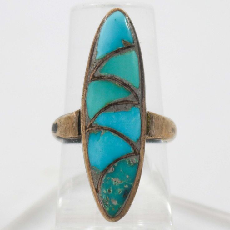 1950s Zuni Sterling Silver Ring with Mosaic Inlaid Natural American Turquoise. Ring Size: 4.75.375” Setting Width, 1.25” Setting Height.125” Band Width Antique Blue Turquoise Ring For Anniversary, Vintage Turquoise Ring With Inlay For Anniversary, Oval Turquoise Rings With Inlay, Oval Turquoise Inlay Rings, Vintage Turquoise Oval Ring, Vintage Blue Turquoise Ring For Anniversary, Antique Turquoise Ring With Patina, Vintage Inlay Rings For Anniversary, Turquoise Art Deco Rings For Gift