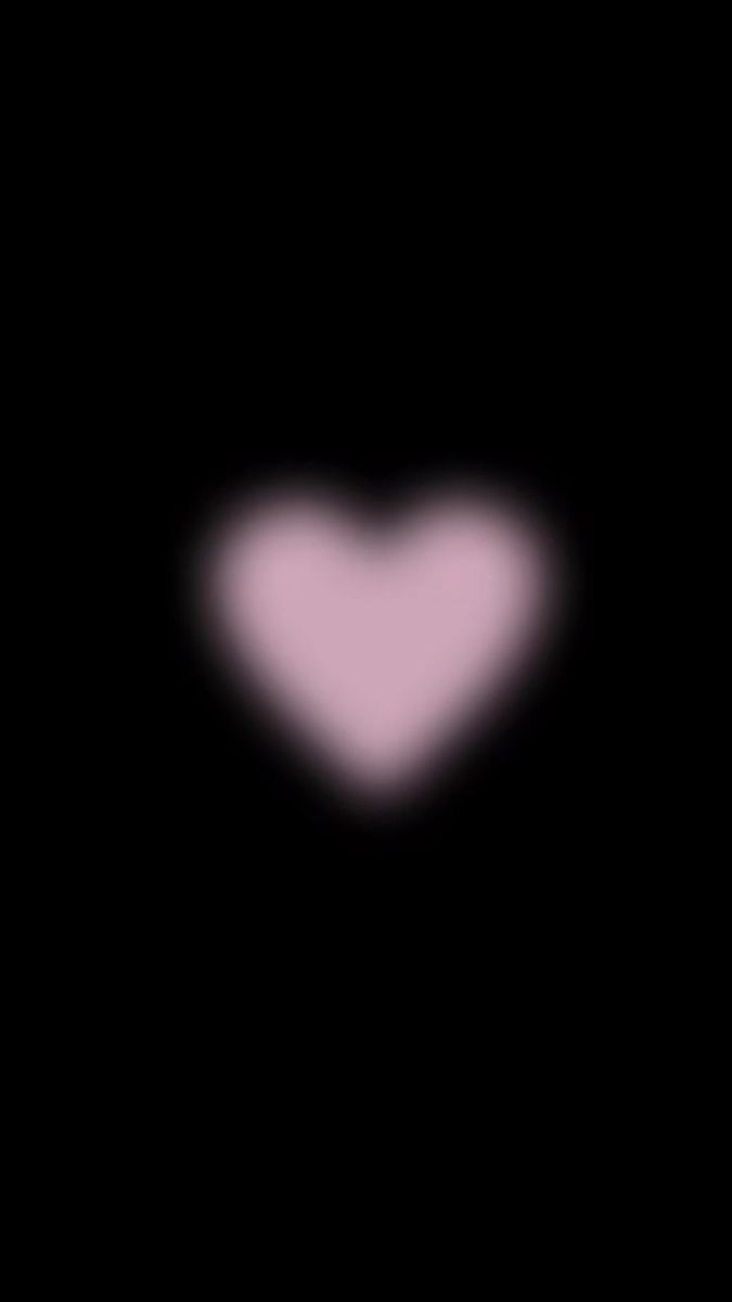 a heart shaped object in the dark