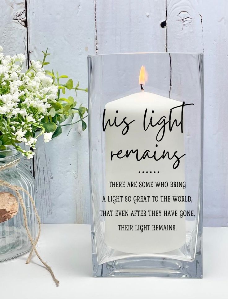 a candle that is sitting next to a vase with flowers in it and the words, his light remains are some who bring a light to the world