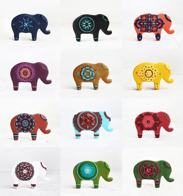 an assortment of elephant figurines are shown in different colors and patterns on white background