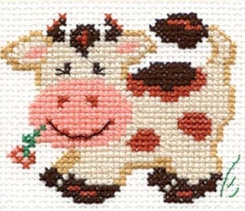 a cross stitch picture of a smiling cow