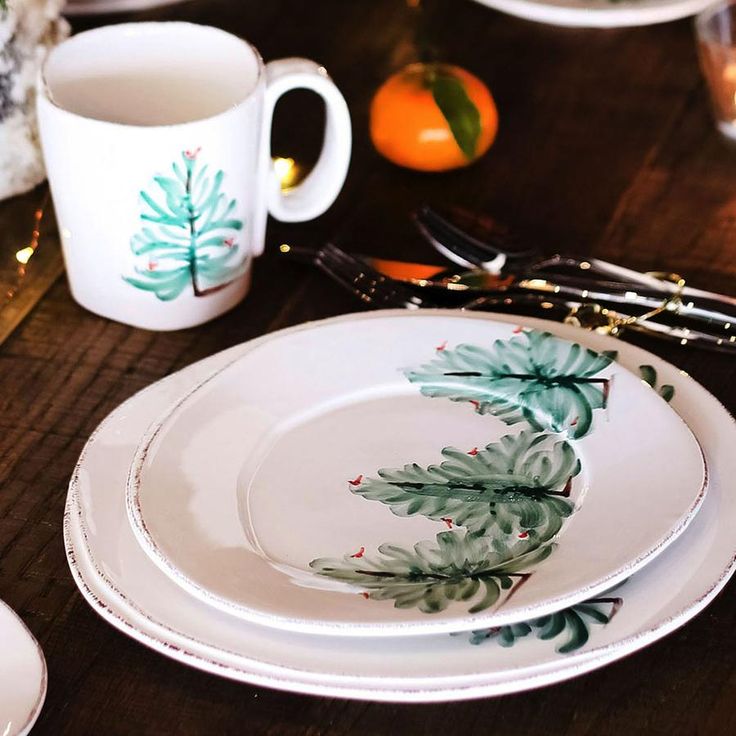 a table with plates, cups and utensils sitting on top of each other