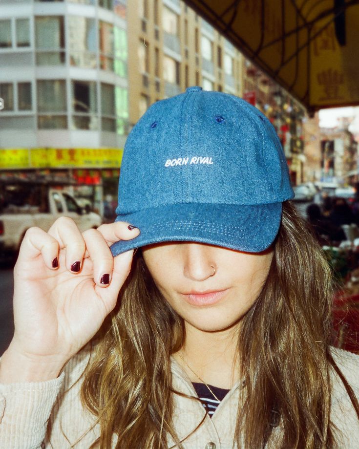 A true classic, this cap is meant to be in the director's chair. We used a medium washed, 10oz. denim on this one for a convergence of workwear and contemporary fashion. 100% indigo denim 6-panel Embroidered logo Self fabric adjustable strap Antique brass metal adjuster MADE IN NYC Medium Wash Denim Baseball Cap With Curved Brim, Adjustable Denim Hat With Curved Visor, Adjustable Denim Baseball Cap In Medium Wash, Adjustable Medium Wash Denim Baseball Cap, Adjustable Denim Dad Hat With Curved Brim, Adjustable Denim Dad Hat Baseball Cap, Adjustable Medium Wash Baseball Cap With Curved Bill, Denim Blue Denim Hat For Streetwear, Adjustable Denim Dad Hat