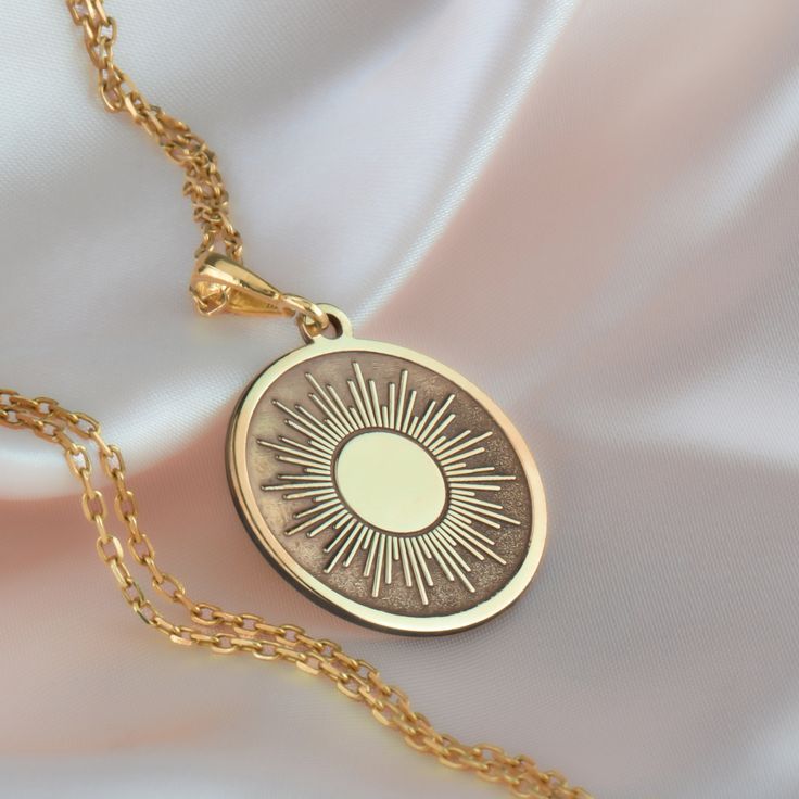 14K Solid Gold Sun Charm Necklace, The Sun Jewelery, Dainty Silver Sun Charm Necklace, Gold Sun Necklace, Personalized The Sun Necklace * Gender :Female * Material Options : 14K Solid Gold, 925 Sterling Silver, Silver Gold Plated * Thickness of Pendant: 0.8 mm * The chain is sent in the same way as the necklace material you choose. * If you prefer a 14k solid gold with triple chains, we will send you the lengths of 37/45/50cm as in one as triple that are presented in the models.  * If you prefer a sterling silver necklace with triple chains, we will send you 37/45/50cm as in one as triple silver chain.  * We send the necklace in an illuminated jewelry box that will be ready to gift to your loved ones ✔ Ready to Ship in 1-2 Business Days ✔ Free shipping worldwide! ✔ Visit our store, browse Spiritual Round Necklace, Cadmium-free, Spiritual Cadmium-free Round Pendant Necklace, Celestial Medallion Necklace As A Gift, Celestial Medallion Necklace As Gift, Celestial Medallion Necklace For Gift, Cadmium-free Brass Pendant Necklace, Gold Sun Necklace, Mens Wedding Rings Gold, Sun Charm