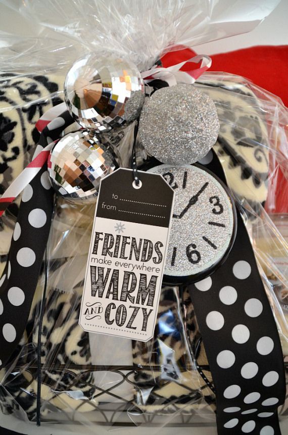 a black and white polka dot ribbon wrapped around a clock with the words friends warm cozy on it